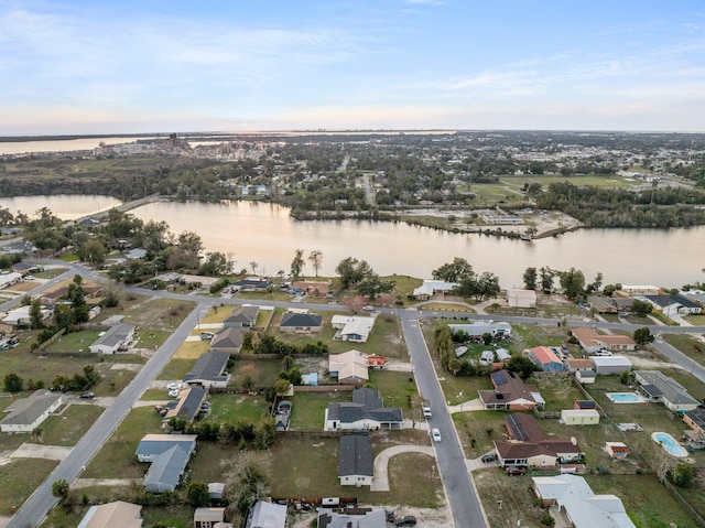 bird's eye view featuring a residential view and a water view