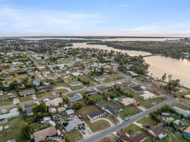 drone / aerial view with a water view and a residential view