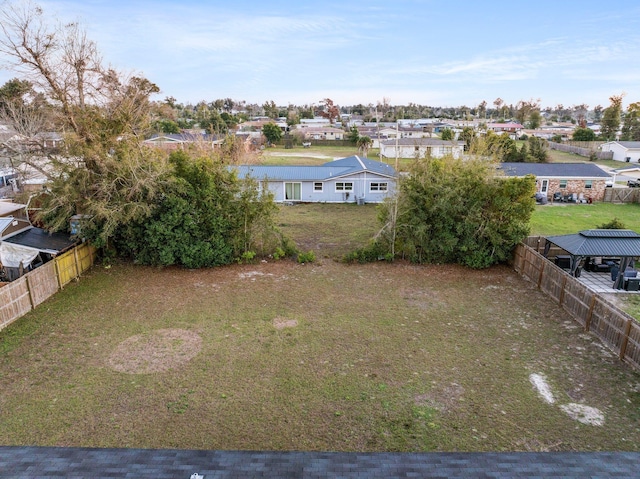 view of yard with fence and a residential view