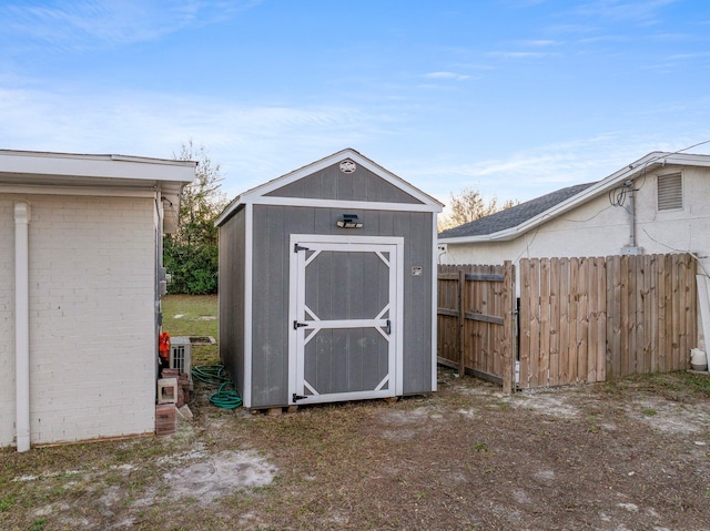 view of shed with fence