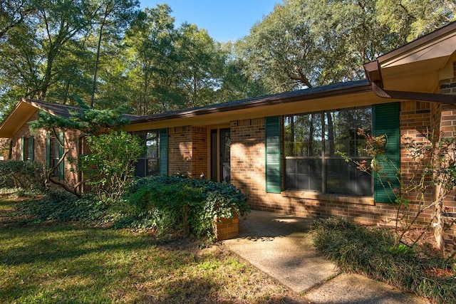 property entrance with brick siding