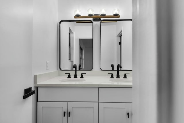 full bathroom featuring a sink and double vanity