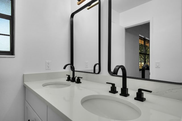 bathroom with double vanity and a sink