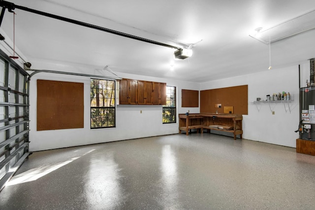 garage featuring gas water heater and a garage door opener