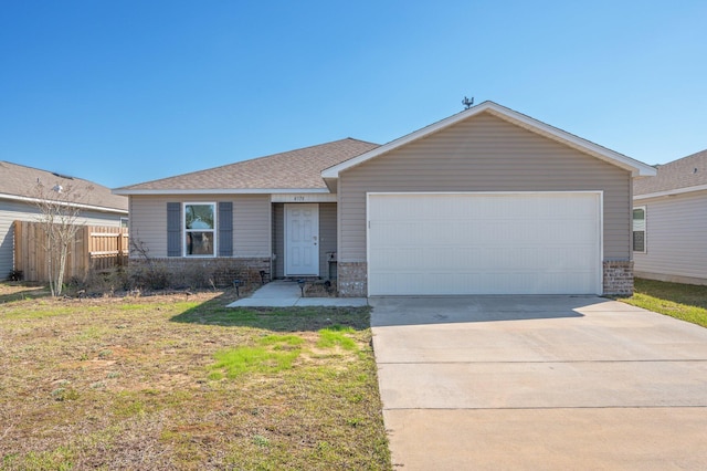 4378 Jitterbug St, Milton, FL 32583 - ranch-style home featuring driveway, an attached garage, fence, brick siding, and roof with shingles