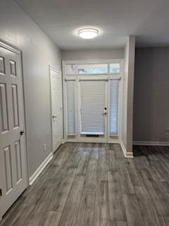 entrance foyer with wood finished floors and baseboards