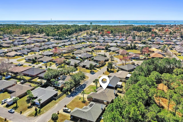 bird's eye view featuring a residential view and a water view