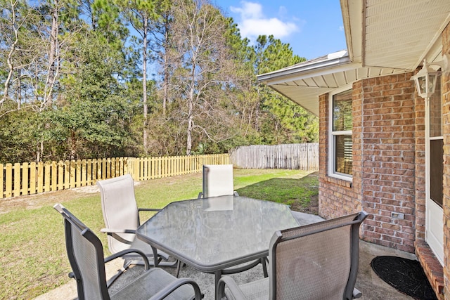 view of patio / terrace with outdoor dining space and a fenced backyard