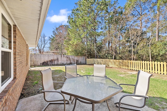 view of patio / terrace with outdoor dining space and a fenced backyard