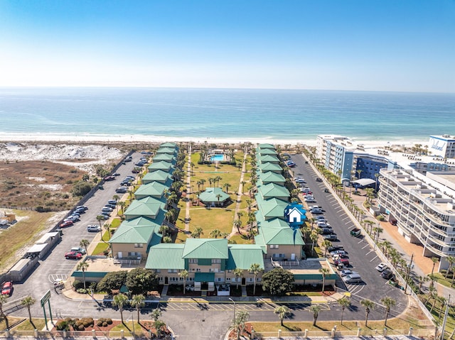 drone / aerial view with a water view and a view of the beach