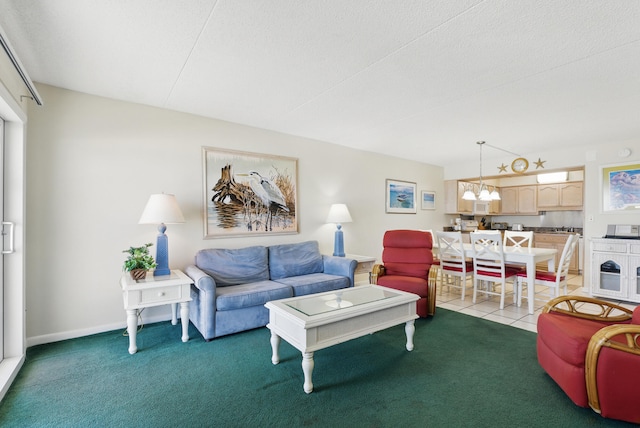 living area featuring light carpet, light tile patterned floors, baseboards, and an inviting chandelier