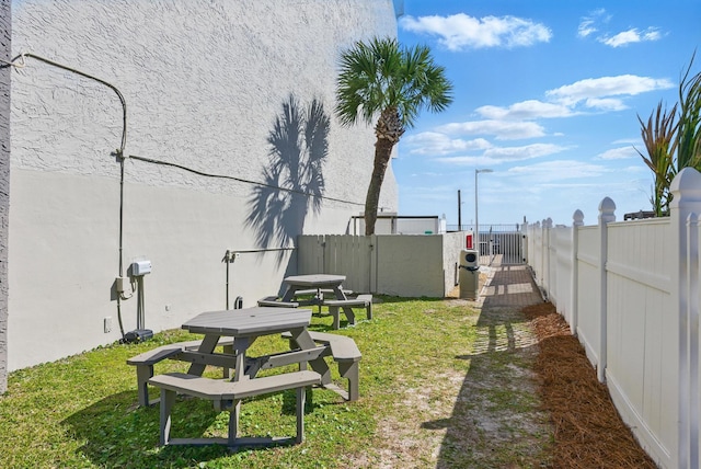 view of yard with a gate and fence