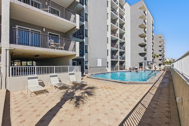 pool featuring a patio area