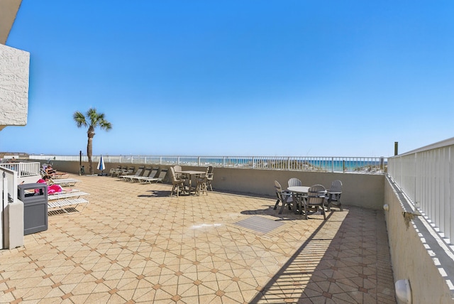 view of patio featuring a water view