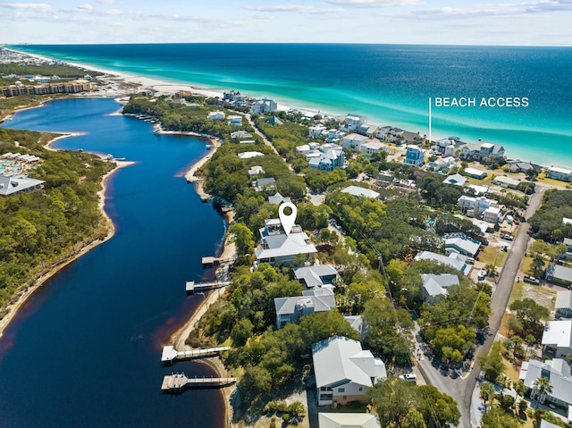 bird's eye view featuring a water view and a view of the beach