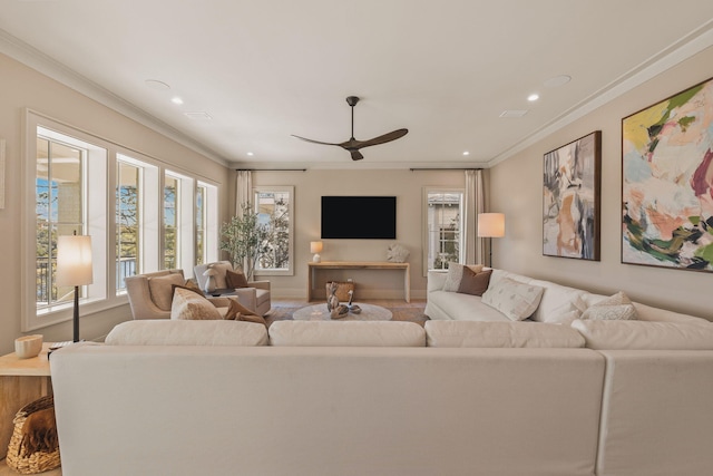 living room with ornamental molding, recessed lighting, ceiling fan, and baseboards