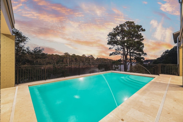 view of pool with a patio area, fence, and a fenced in pool