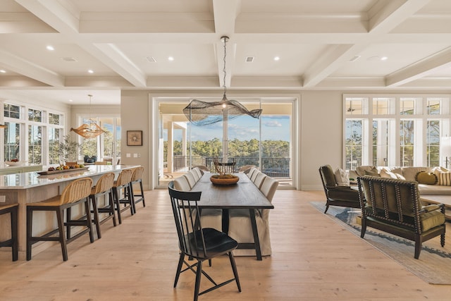 dining area with light wood-style floors, recessed lighting, coffered ceiling, and beamed ceiling