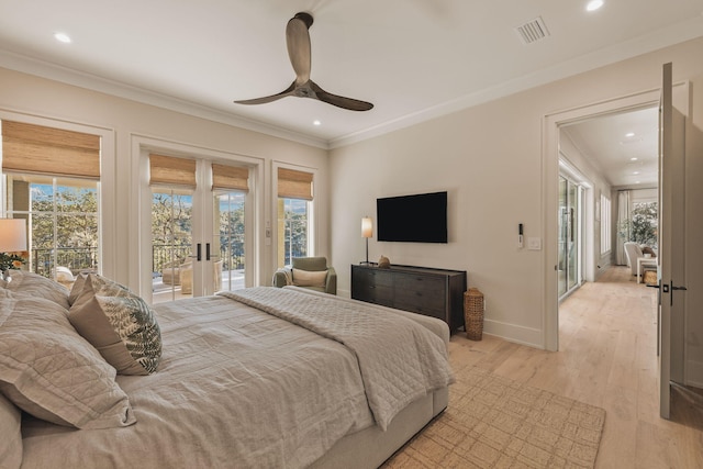 bedroom featuring access to outside, visible vents, crown molding, and multiple windows