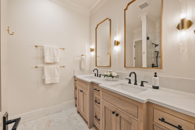 bathroom featuring crown molding, visible vents, a sink, and double vanity