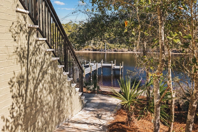 dock area with a water view and stairs