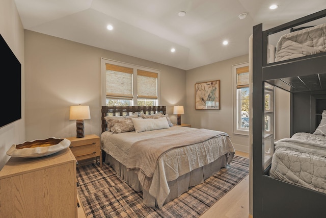 bedroom with dark wood-style flooring and recessed lighting