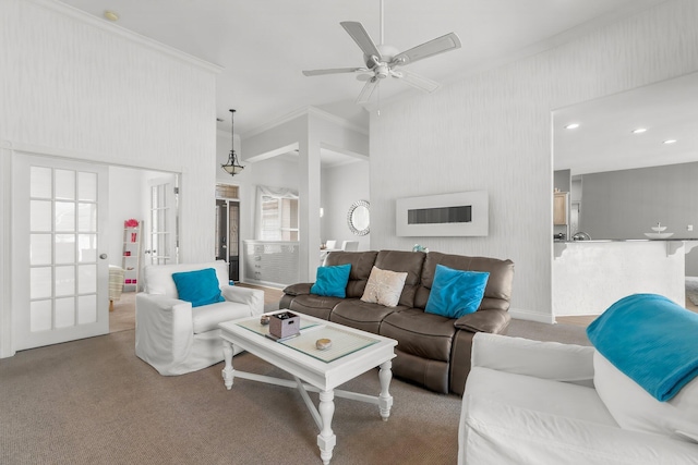 living area featuring a ceiling fan, recessed lighting, light carpet, and crown molding