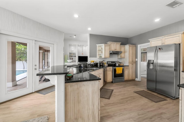 kitchen featuring under cabinet range hood, visible vents, a kitchen breakfast bar, appliances with stainless steel finishes, and open shelves