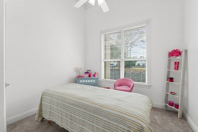 carpeted bedroom featuring a ceiling fan and baseboards