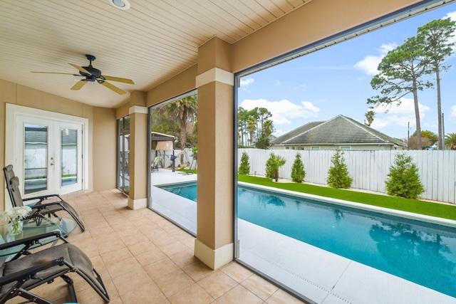 view of swimming pool featuring a fenced in pool, french doors, a patio, a ceiling fan, and a fenced backyard