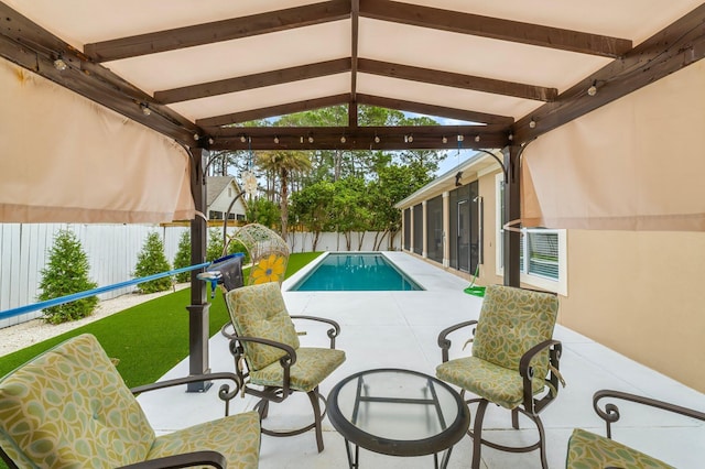 view of swimming pool with a fenced backyard, a fenced in pool, and a patio