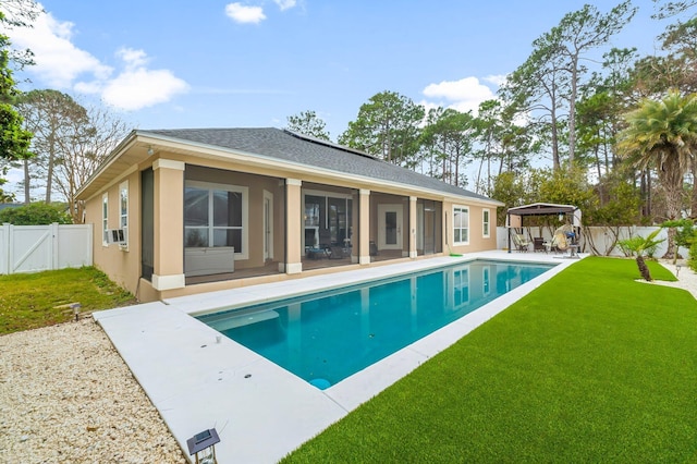 view of swimming pool featuring a fenced in pool, a fenced backyard, cooling unit, a yard, and a patio area