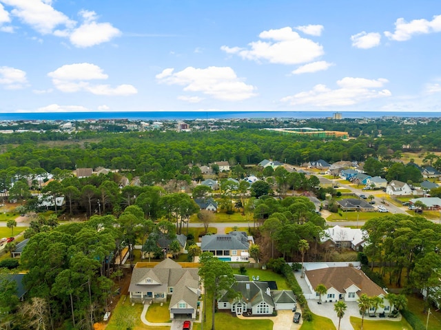 drone / aerial view with a residential view and a water view