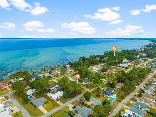 birds eye view of property with a residential view and a water view