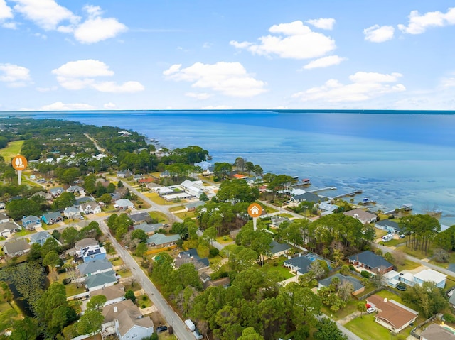 birds eye view of property with a water view and a residential view