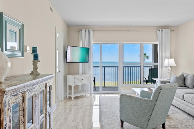 living room featuring wood finish floors and visible vents