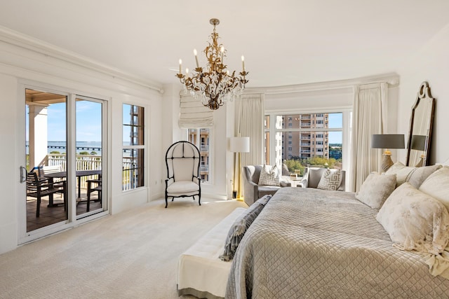 carpeted bedroom with access to exterior, multiple windows, a chandelier, and crown molding