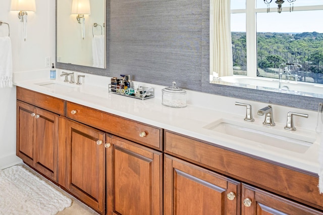 bathroom featuring double vanity and a sink