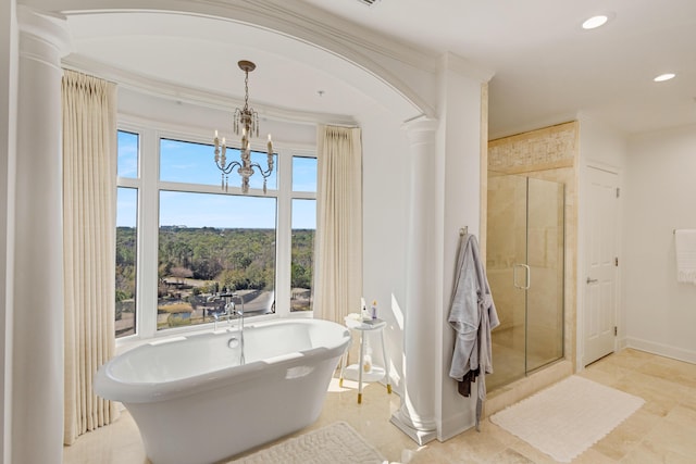 full bathroom featuring decorative columns, recessed lighting, a stall shower, a freestanding tub, and baseboards