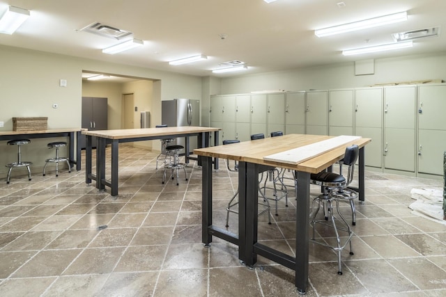 dining area with visible vents and a workshop area