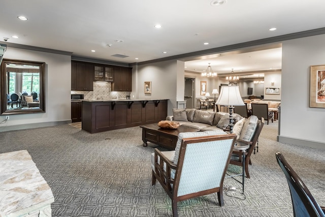 living area featuring baseboards and crown molding