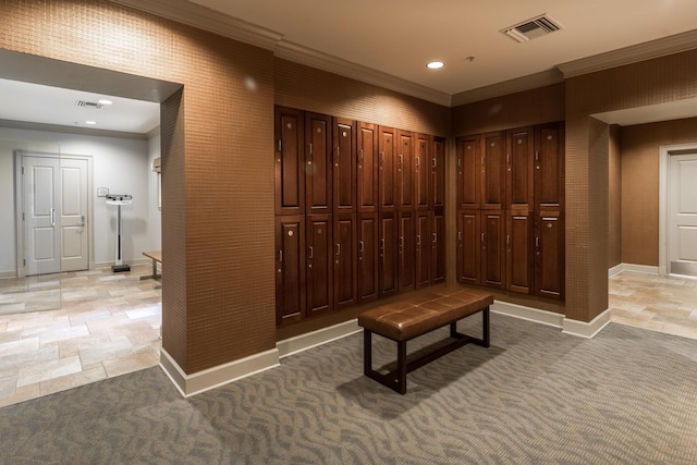 hall with baseboards, ornamental molding, visible vents, and light colored carpet