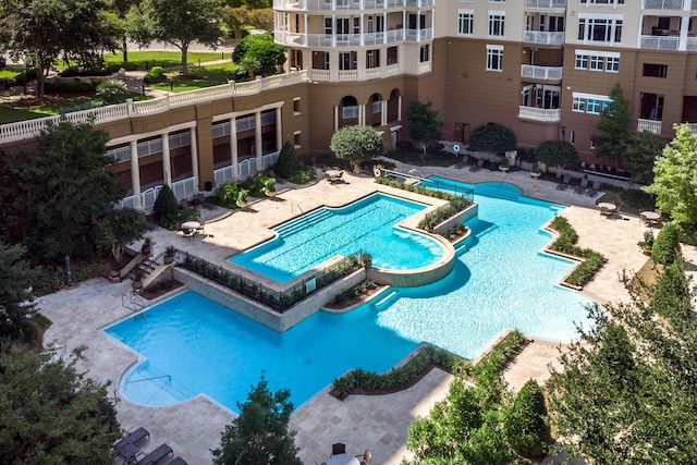 view of swimming pool featuring a patio area