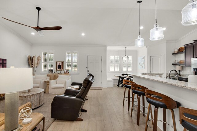 846 Cannon Ln, Destin, FL 32541 - living room featuring light wood-style flooring, a ceiling fan, crown molding, and recessed lighting