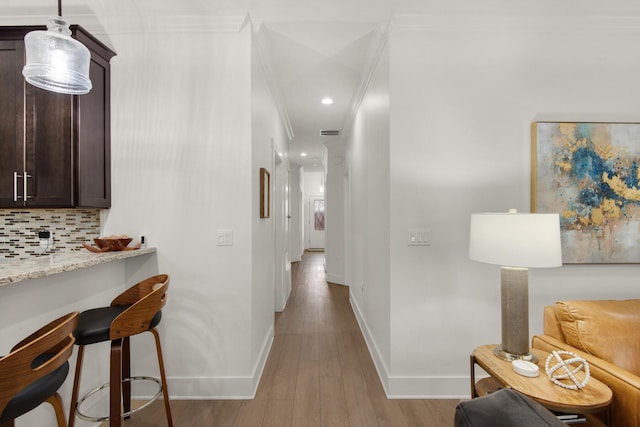 846 Cannon Ln, Destin, FL 32541 - hall with visible vents, baseboards, light wood-style flooring, ornamental molding, and recessed lighting
