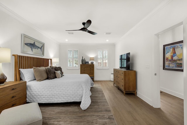 846 Cannon Ln, Destin, FL 32541 - bedroom with visible vents, baseboards, ceiling fan, ornamental molding, and wood finished floors