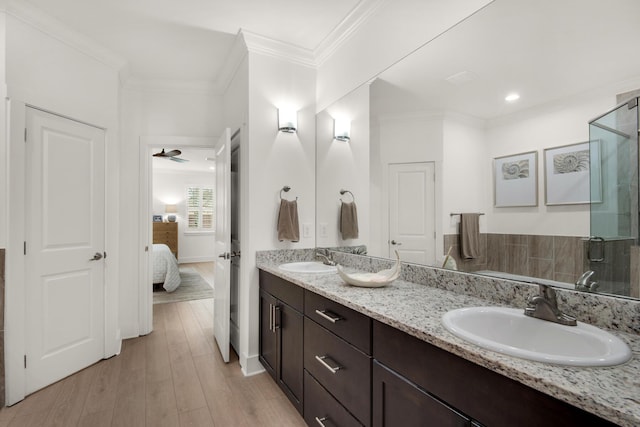 846 Cannon Ln, Destin, FL 32541 - full bath with ensuite bath, ornamental molding, a sink, and wood finished floors