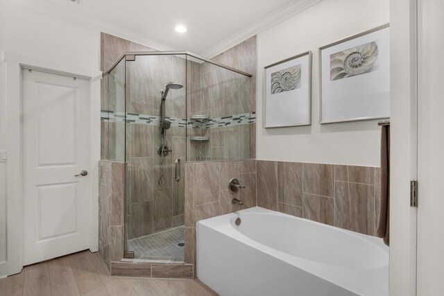 846 Cannon Ln, Destin, FL 32541 - full bathroom featuring a stall shower, a garden tub, crown molding, and wood finished floors