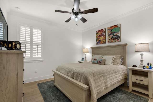 846 Cannon Ln, Destin, FL 32541 - bedroom featuring ceiling fan, ornamental molding, wood finished floors, and baseboards