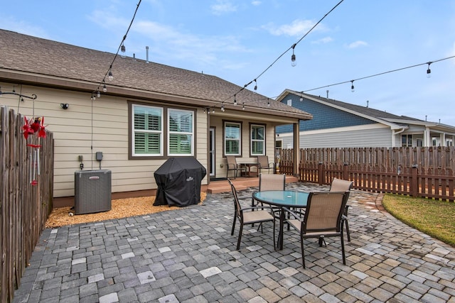 846 Cannon Ln, Destin, FL 32541 - view of patio featuring outdoor dining space, central AC, grilling area, and a fenced backyard